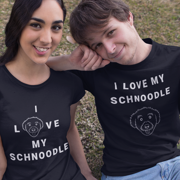 One man and two women posing for a photo wearing T-Shirts from the 