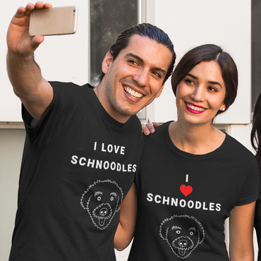 One man and one woman posing for a selfie wearing T-Shirts from the 